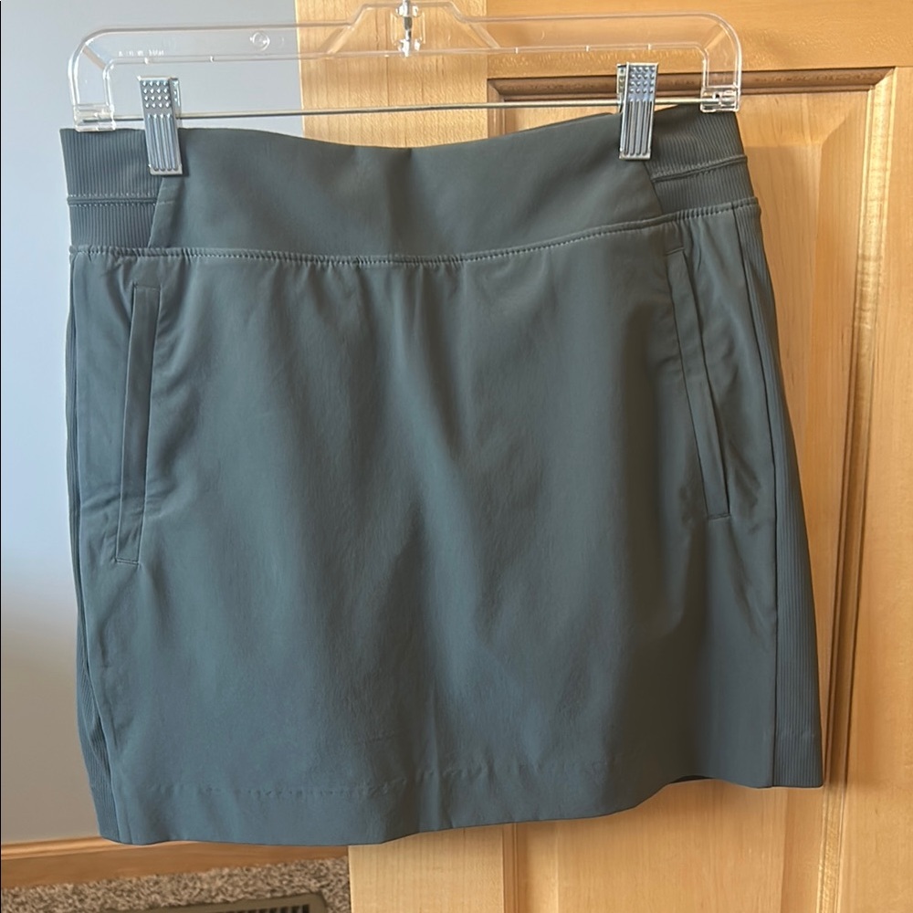 Moss green colored like new skort from Athleta with zip side Pockets.